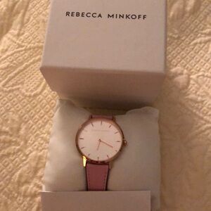 Pink watch by Rebecca Minkoff. NWOT. beautiful pink leather band. Never worn.
